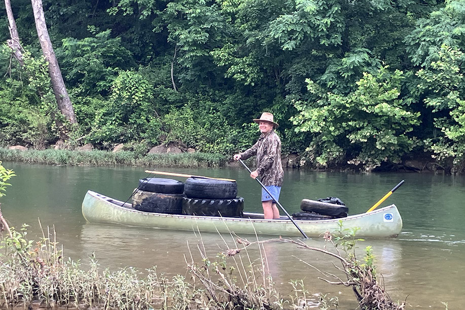 Loaded Canoes with Tires and Debris